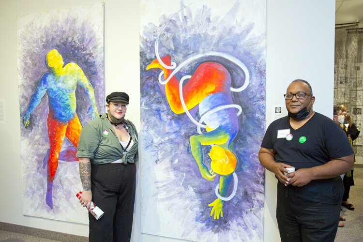 Art by Tony Williams (left) with Sam Butler (right) of the Artist Archives curator team.