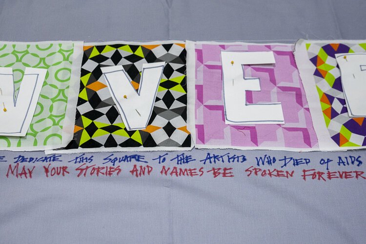 LGBTQ+ artists of CONVERGE participate in the quilt dedicated to all the LGBTQ+ artists that have died of AIDS at the MetroHealth Reception.