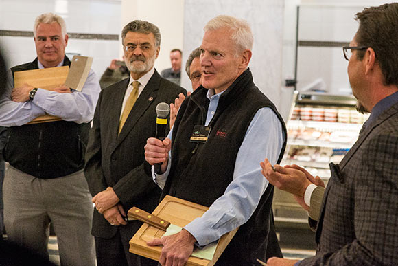 Jeff Heinen speaking with brother Tom and Mayor Jackson on his right
