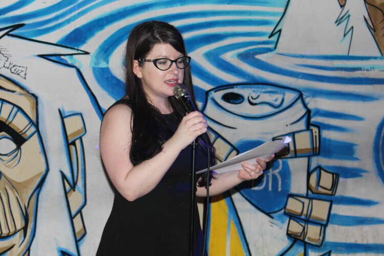 Nikki giving opening remarks to the teens at Lake Erie Ink's Book Launch of Roots and Branches in 2018