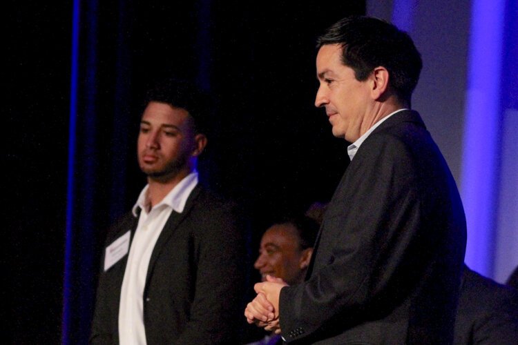 Gregory Perelka, board president of Esperanza, awards Fiesta of Hope students Friday, June 21st at the Cleveland Renaissance Ballroom
