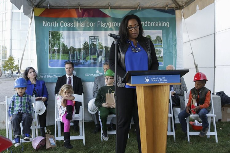 Heather Holmes, Downtown Cleveland Alliance spokeswoman, speaks at the groundbreaking for downtown Cleveland’s first public playground.