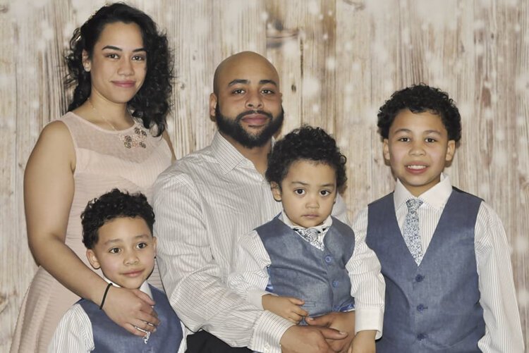 Tanisha Velez with her fiancé and three sons.