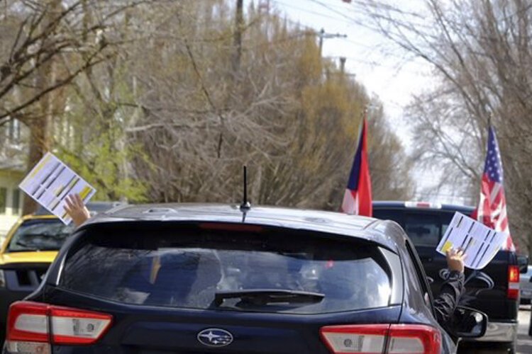 A caravan of cars drives through the Clark-Fulton neighborhood in Cleveland several months ago in an attempt to get the local Hispanic community registered to vote and counted in the Census.