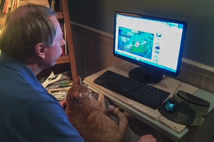 John Niedzialek with Casimir doing some weather research.