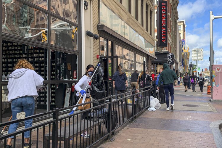 Clean up after the rioting in downtown Cleveland.