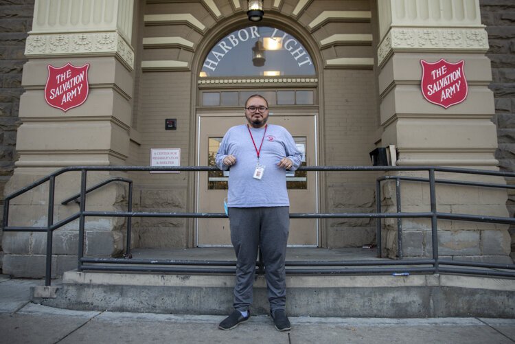 Wilber Argueta stands outside the Zelma George Salvation Army Shelter, where he helped organize online tutoring for 12 homeless youth this summer.