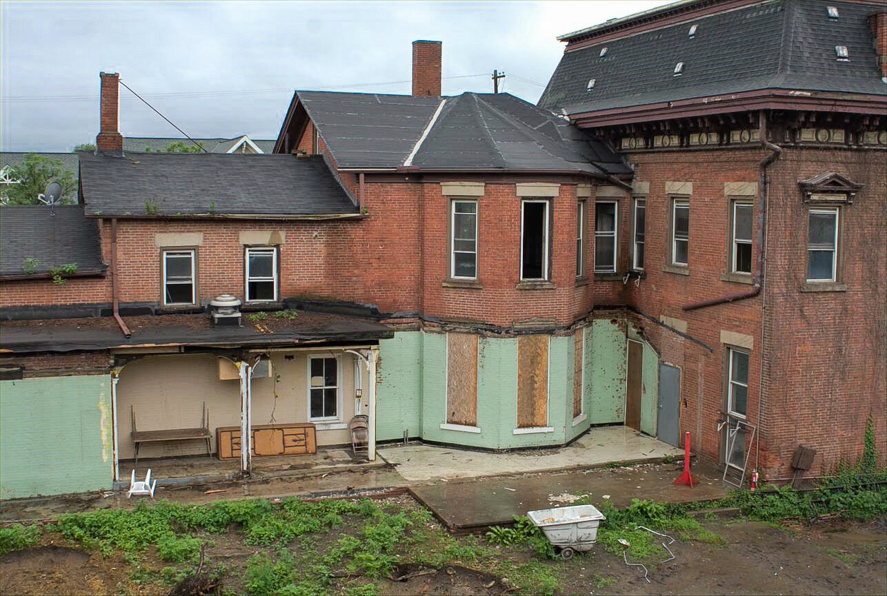 Demolition of the connecting non-historic tunnels revealed an original porch on the Cook-Bousfield mansion.