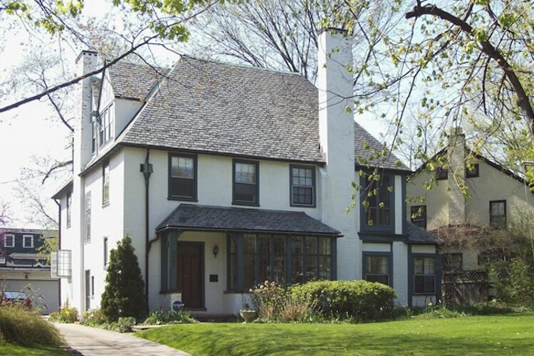 Designed in a French Eclectic style, the home at 3280 Maynard employed the use of stuccoed and painted masonry walls, large chimneys, and a steeply pitched roof. 