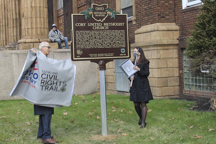 The new Ohio Historical Marker at Cory United Methodist Church is unveiled by Burt Logan and Margaret Lann.