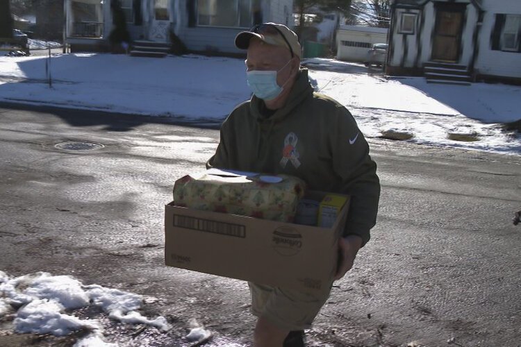 Lake County veteran, Don Buckholz, hand delivers a gift to Terrance.