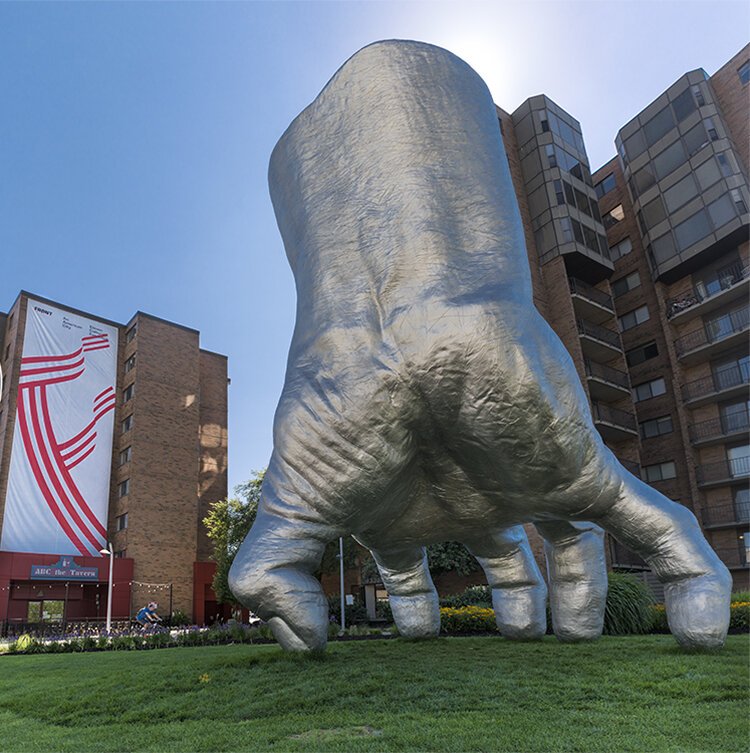 <span class="content-image-text">“Judy’s Hand Pavilion” by Tony Tasset consists of a 21-foot-tall hand pressing its thumb into an Uptown plaza.</span>