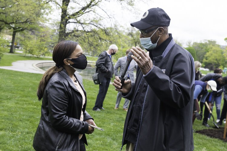 Jesse Owens’ cousin, Tyrone Owens, right, was on hand for the planting ceremony.