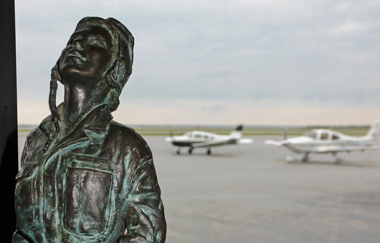 Bronze sculpture looking at the sky at the IWASM