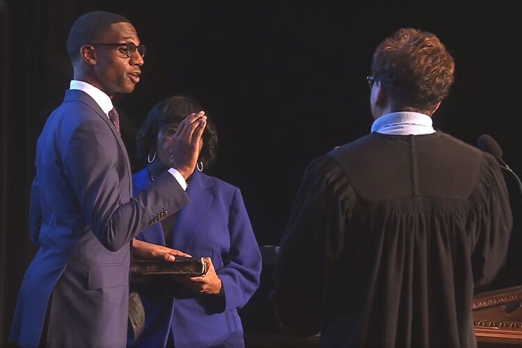 Ohio Supreme Court Justice Melody Stewart administered the oath of office to Justin Bibb while his mother, Charlene Nichols, held the Bible