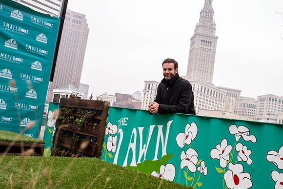 Tom Starinsky at the Lawn, a pocket park next to SmallBox and boasts furniture made from salvaged materials