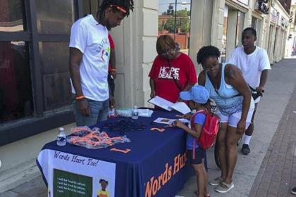 Craven Smith works a table outside the Social Lounge in East Cleveland in 2019 for his Live2Love Project.