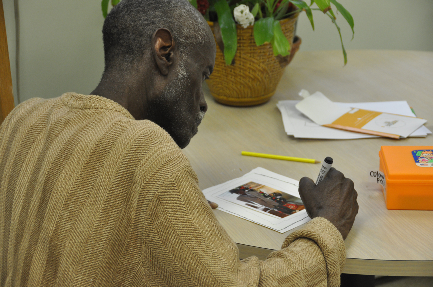 Participants in the Benjamin Rose Institute on Aging’s Adult Day Program paint greeting cards to share with family and friends