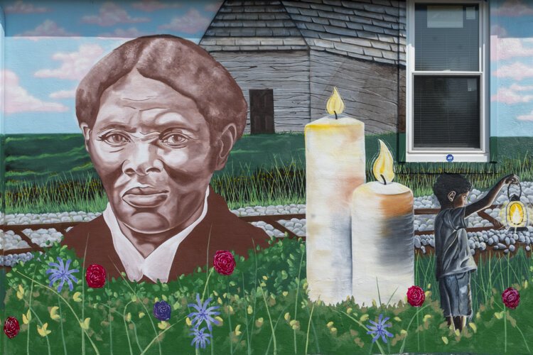 Graffiti HeArt, a  non-profit organization, engaged artists Stina Aleah, Davon Brantley, and Christa Childs for this Underground Railroad – Road to Freedom mural in Bedford. 